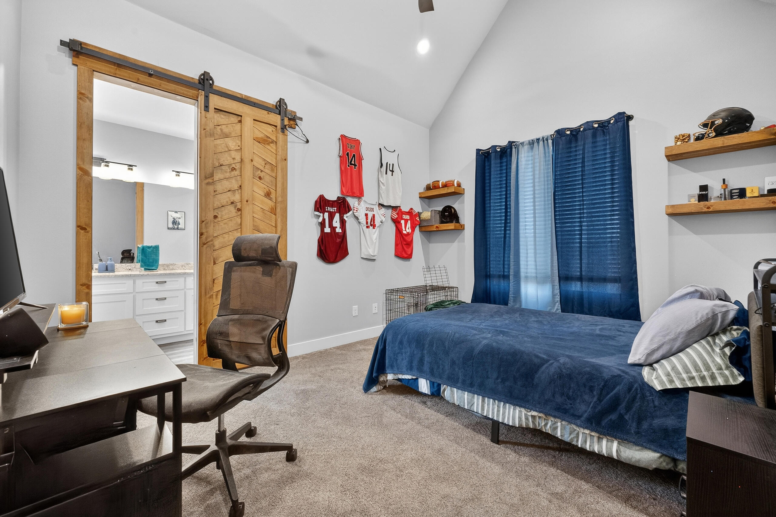 11211 Grover Avenue Lubbock, TX 79424 - Photo 18 of 43 a bedroom with a bed and a desk