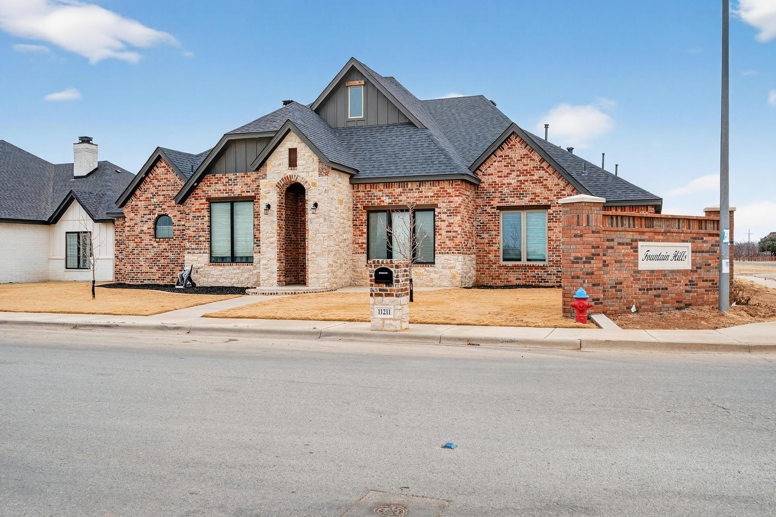 11211 Grover Avenue Lubbock, TX 79424 - Photo 2 of 43 a front view of a house with a yard