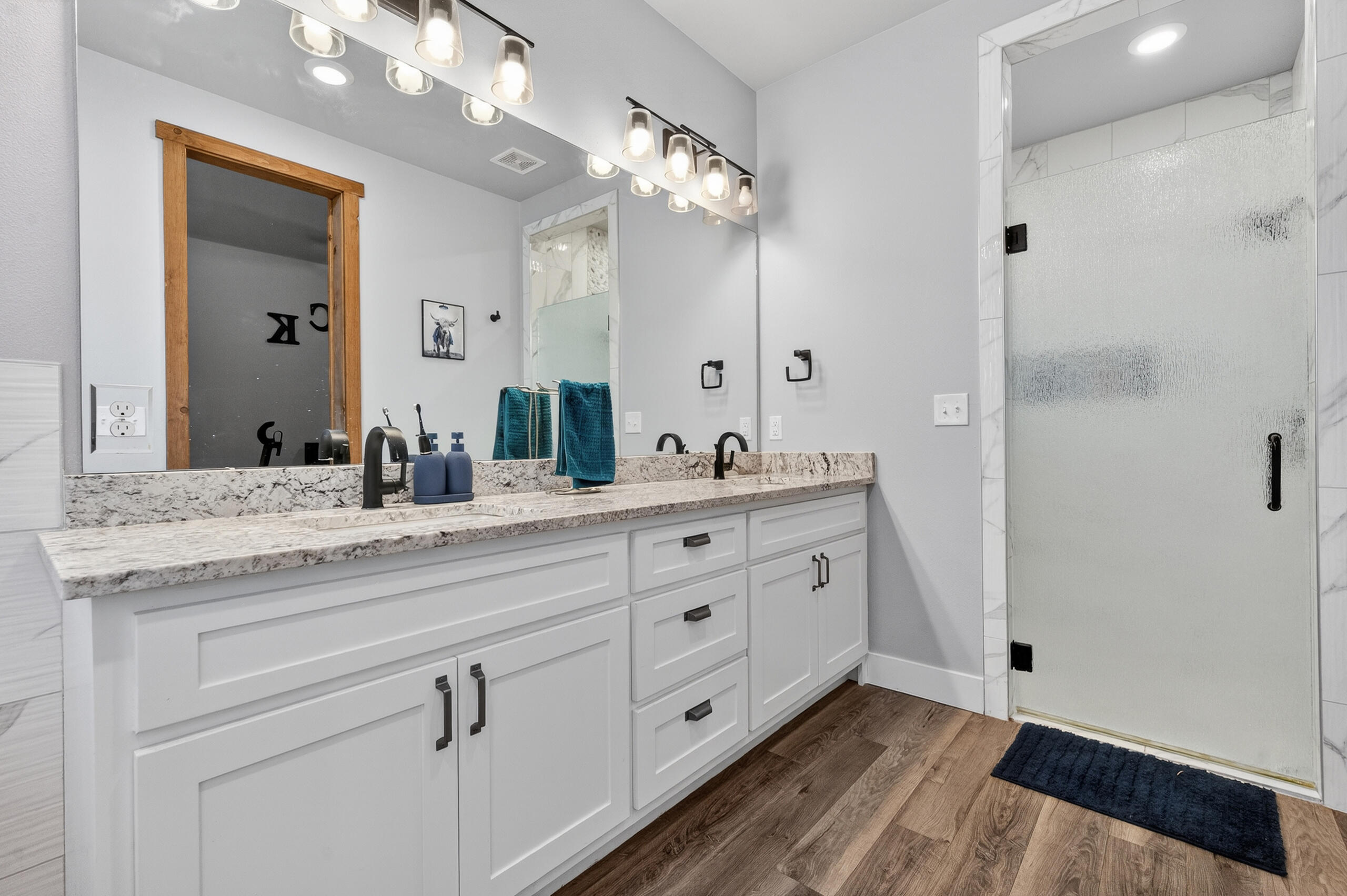 11211 Grover Avenue Lubbock, TX 79424 - Photo 21 of 43 a bathroom with a double vanity sink and mirror