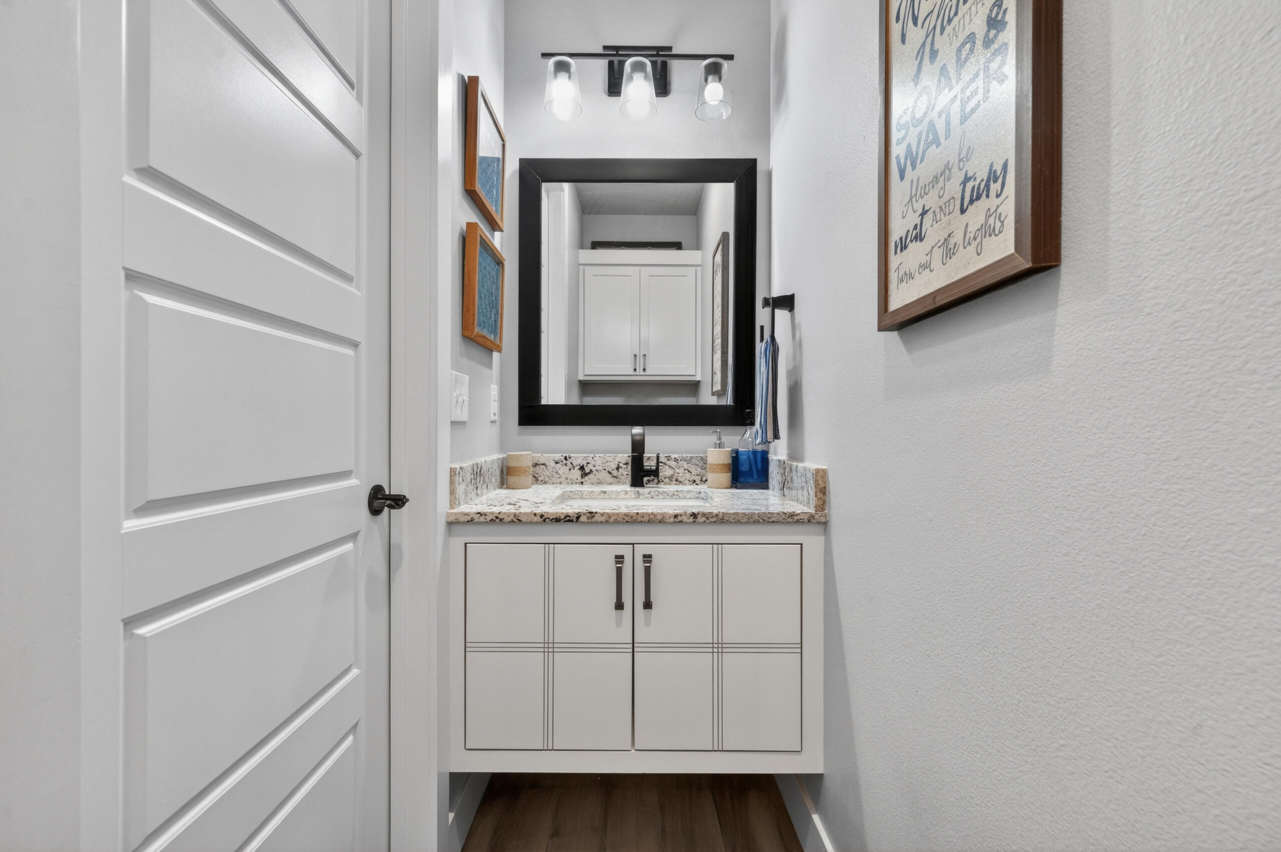 11211 Grover Avenue Lubbock, TX 79424 - Photo 22 of 43 a bathroom with a sink and a mirror