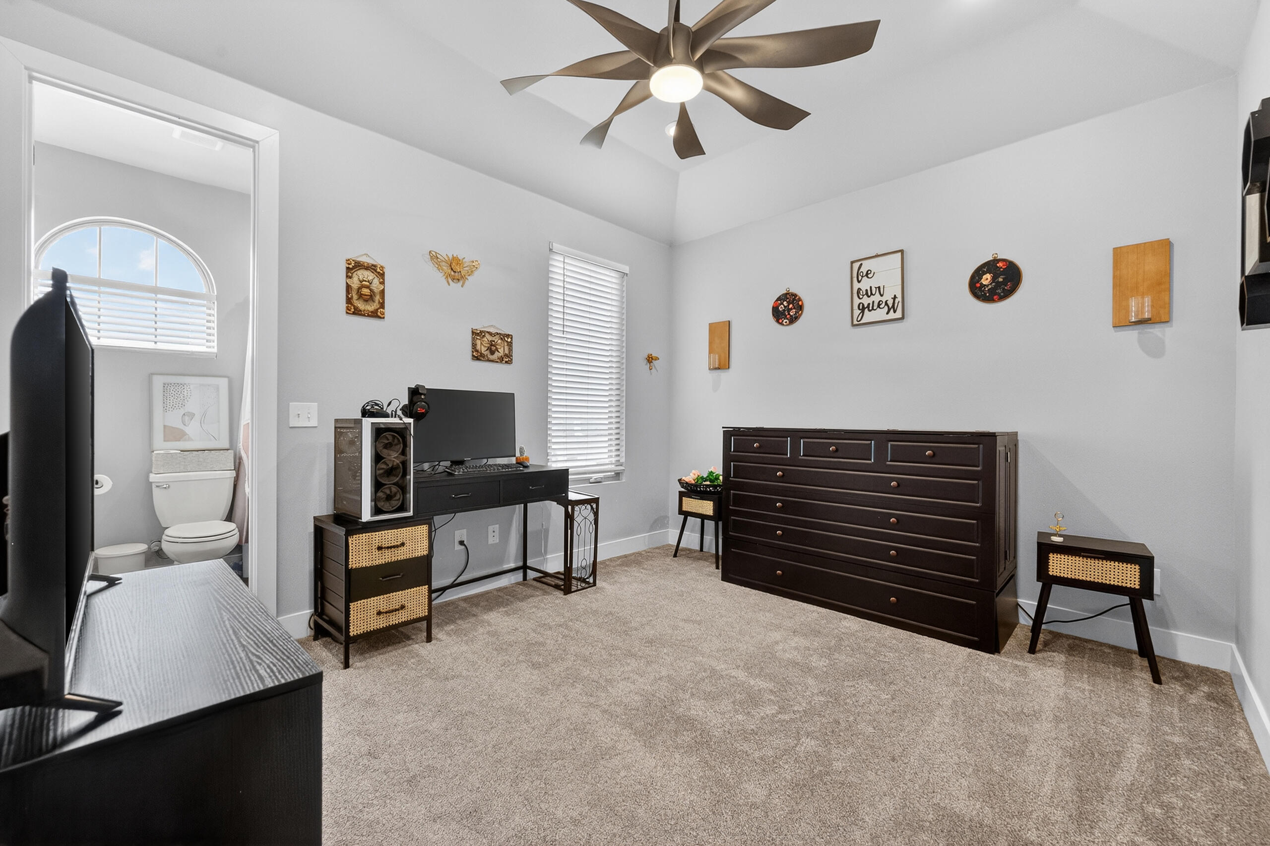 11211 Grover Avenue Lubbock, TX 79424 - Photo 26 of 43 a living room with furniture and a flat screen tv