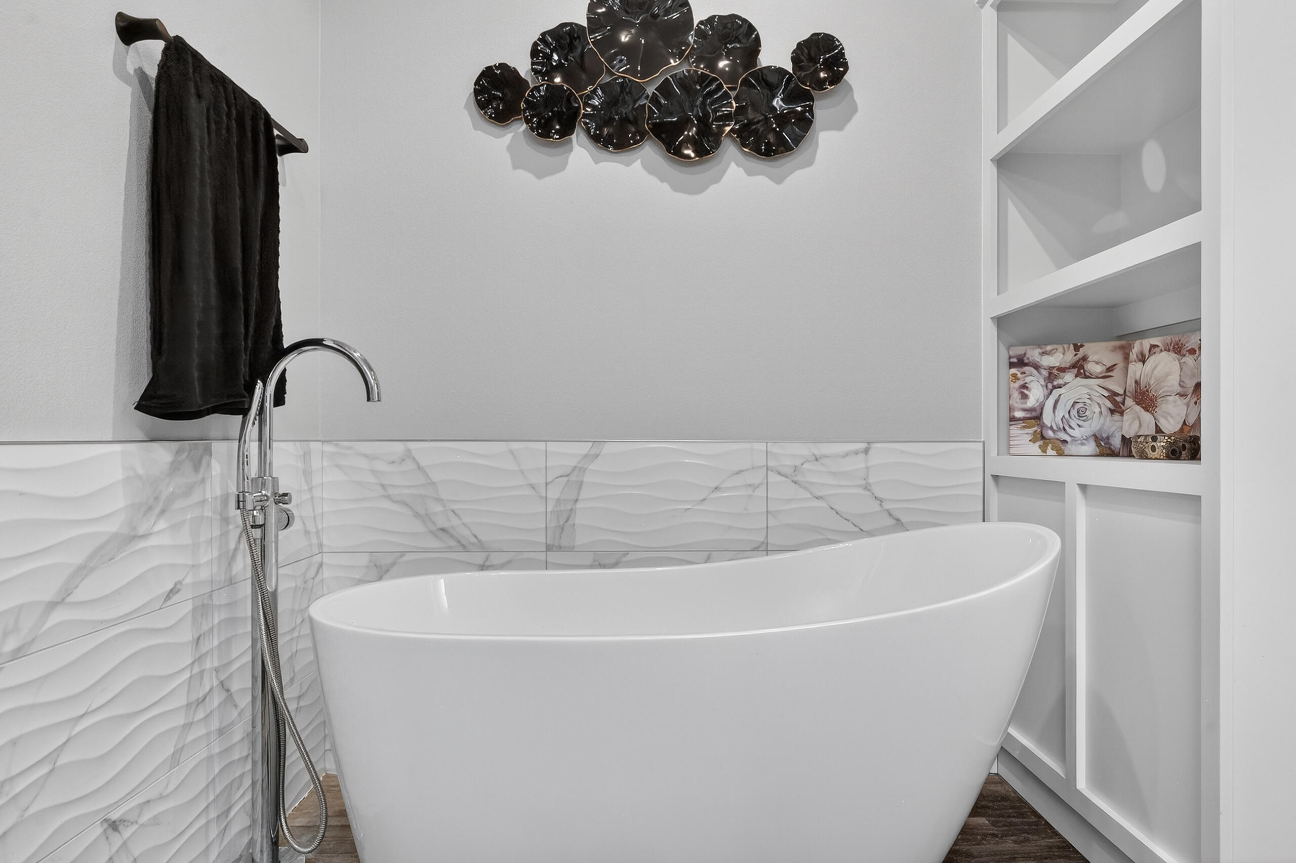 11211 Grover Avenue Lubbock, TX 79424 - Photo 31 of 43 a white bath tub sitting in a bathroom