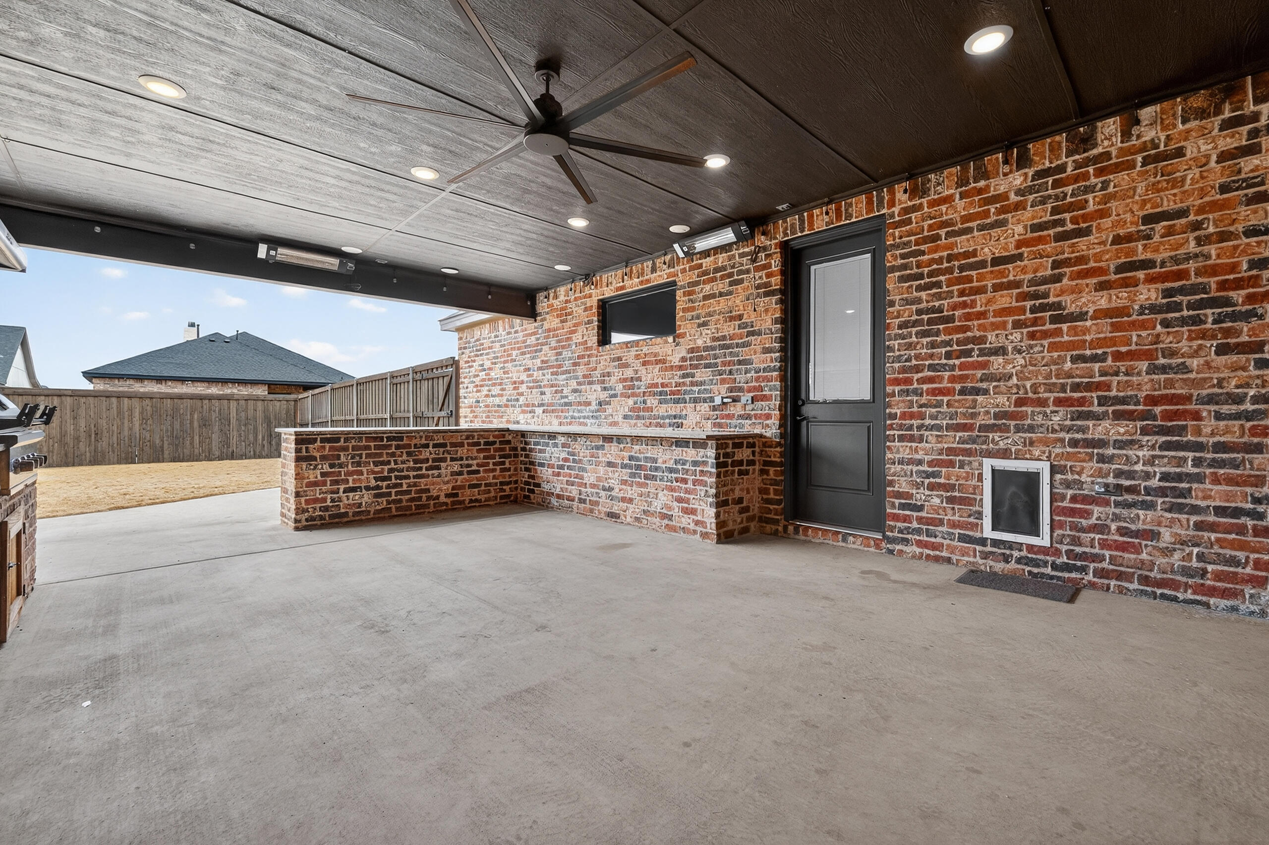 11211 Grover Avenue Lubbock, TX 79424 - Photo 41 of 43 a view of an empty room with a fireplace