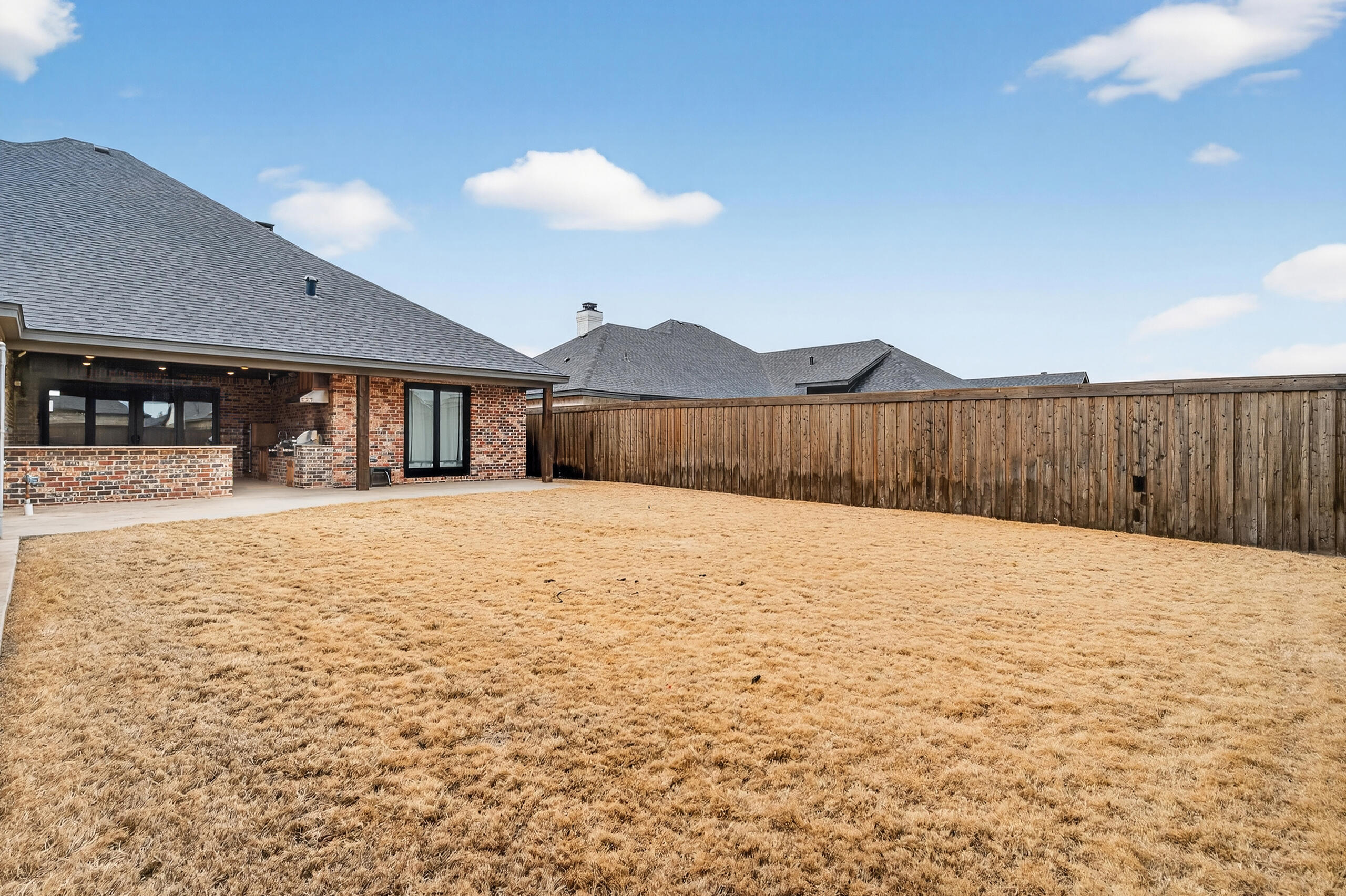11211 Grover Avenue Lubbock, TX 79424 - Photo 42 of 43 a view of wooden house with a yard