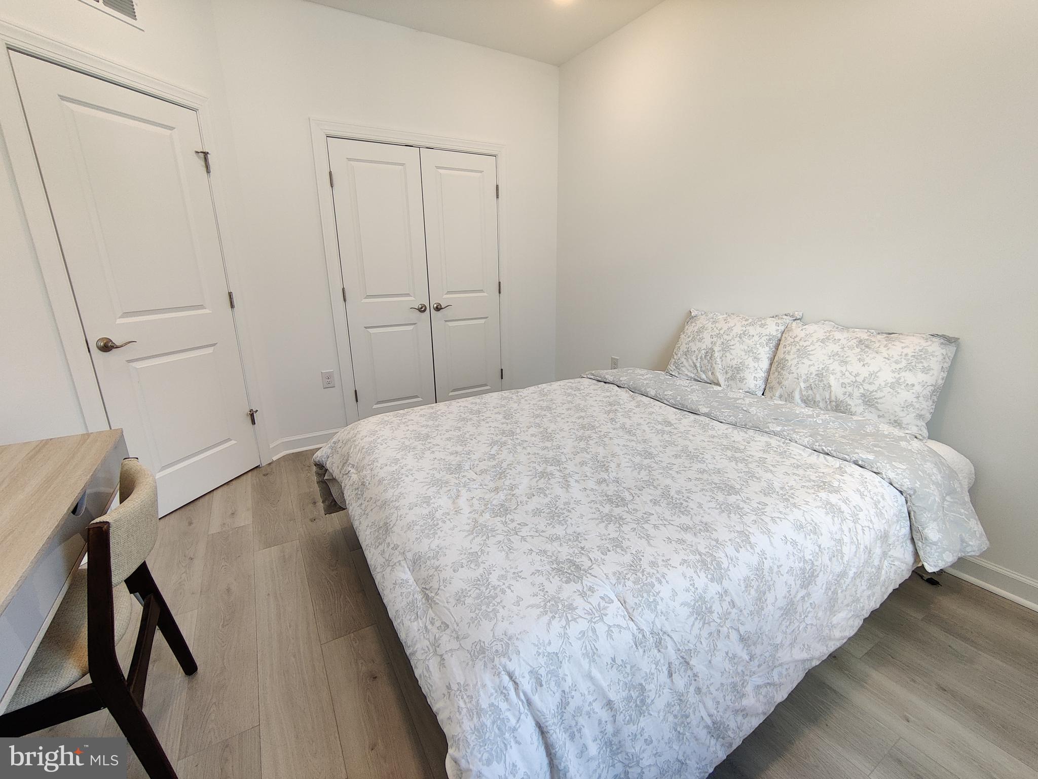 5002 Longmire Way, Unit 70 Chantilly, VA 20151 - Photo 14 of 28 a bedroom with a bed and closet