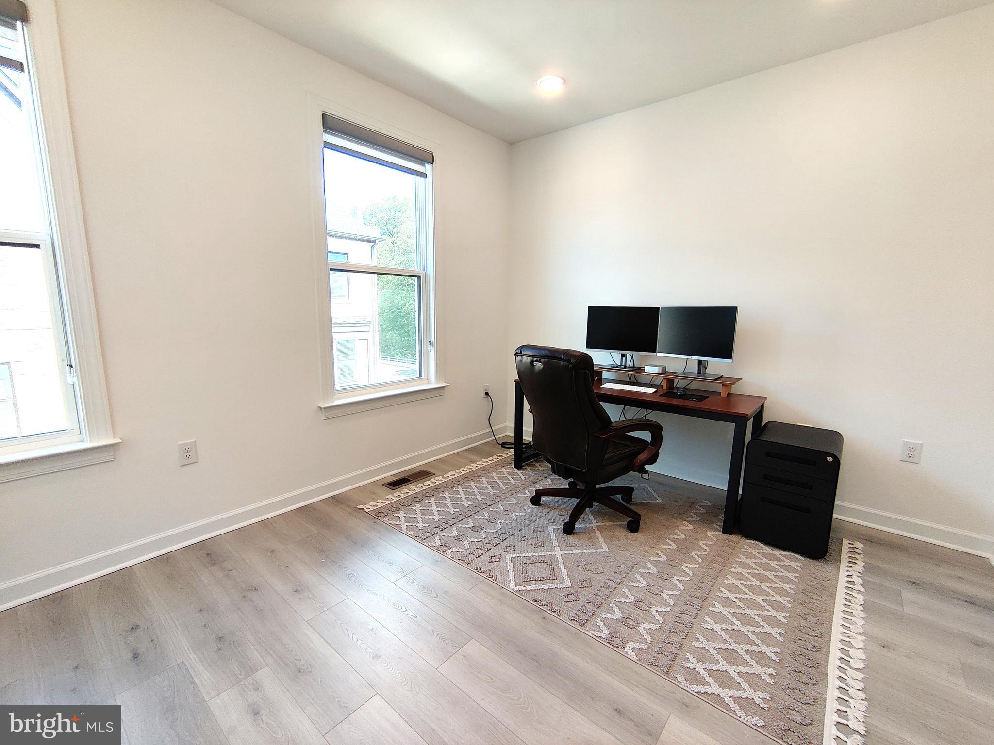 5002 Longmire Way, Unit 70 Chantilly, VA 20151 - Photo 15 of 28 a view of workspace with wooden floor windows