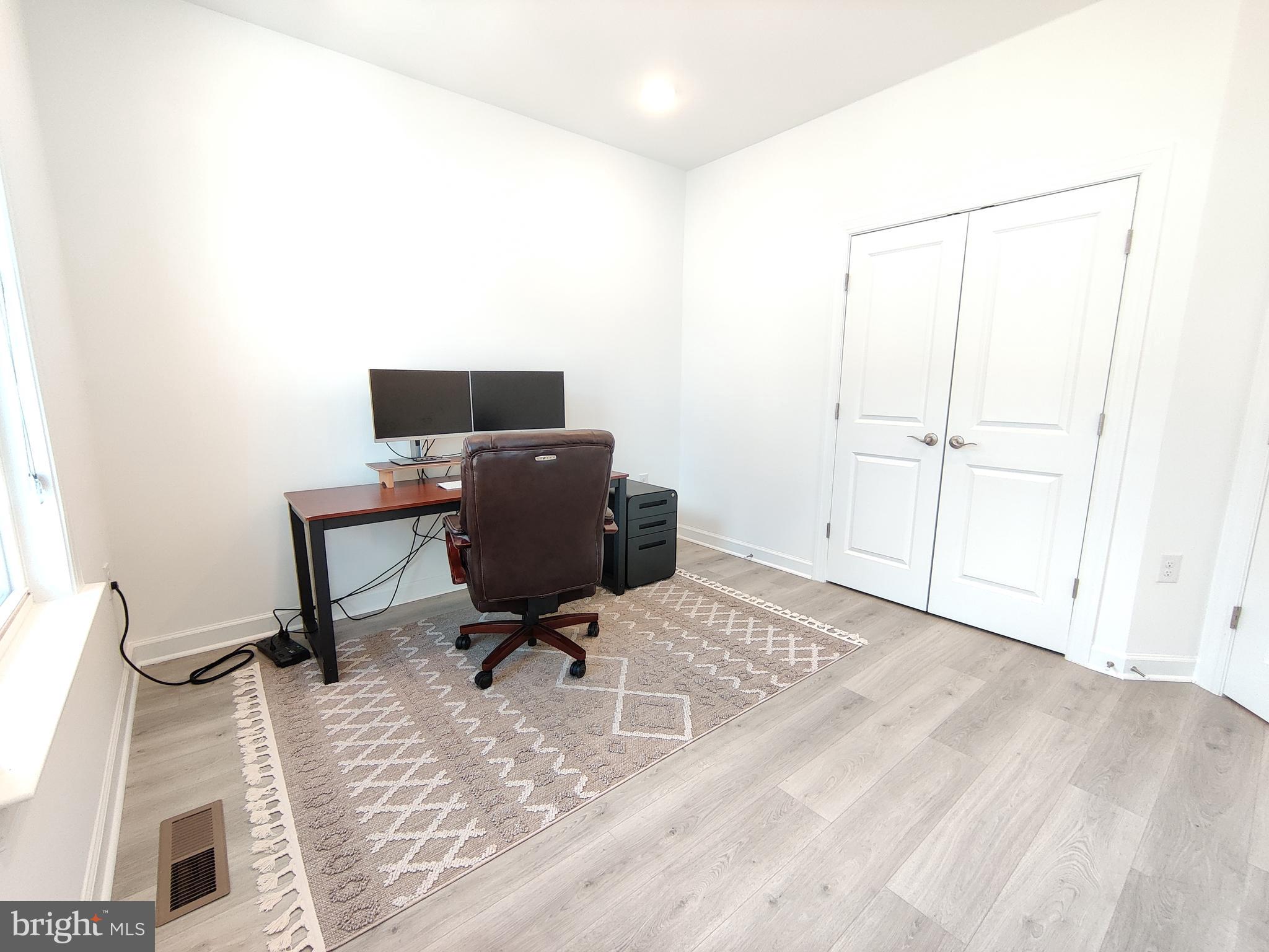5002 Longmire Way, Unit 70 Chantilly, VA 20151 - Photo 16 of 28 a view of a workspace with furniture and a window