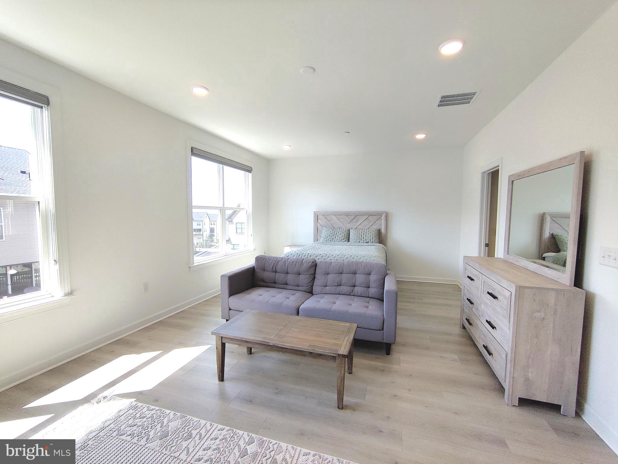5002 Longmire Way, Unit 70 Chantilly, VA 20151 - Photo 19 of 28 a living room with furniture and a window