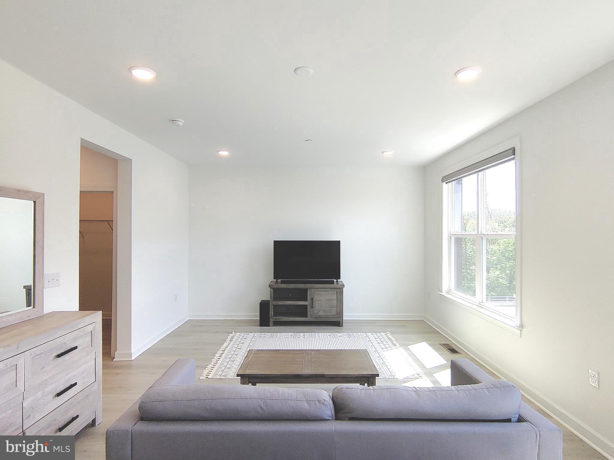 5002 Longmire Way, Unit 70 Chantilly, VA 20151 - Photo 20 of 28 a living room with furniture and a flat screen tv