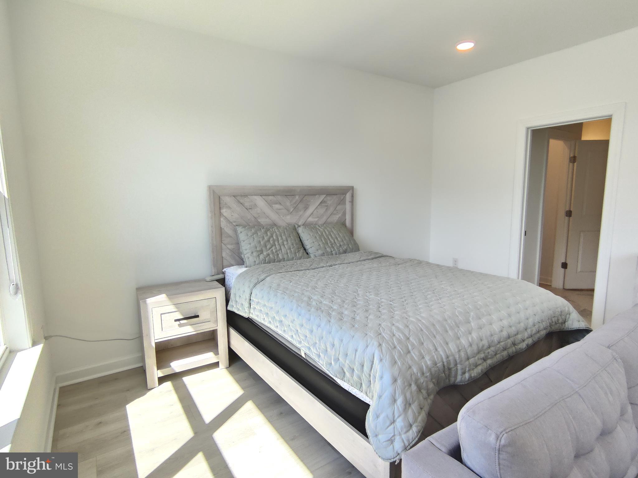 5002 Longmire Way, Unit 70 Chantilly, VA 20151 - Photo 21 of 28 a bed room with a bed and a chair