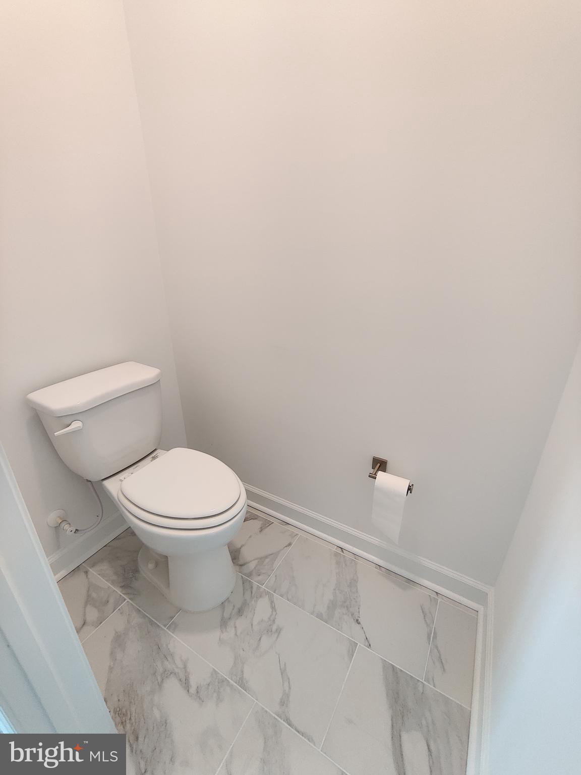 5002 Longmire Way, Unit 70 Chantilly, VA 20151 - Photo 23 of 28 a white toilet sitting next to a shower