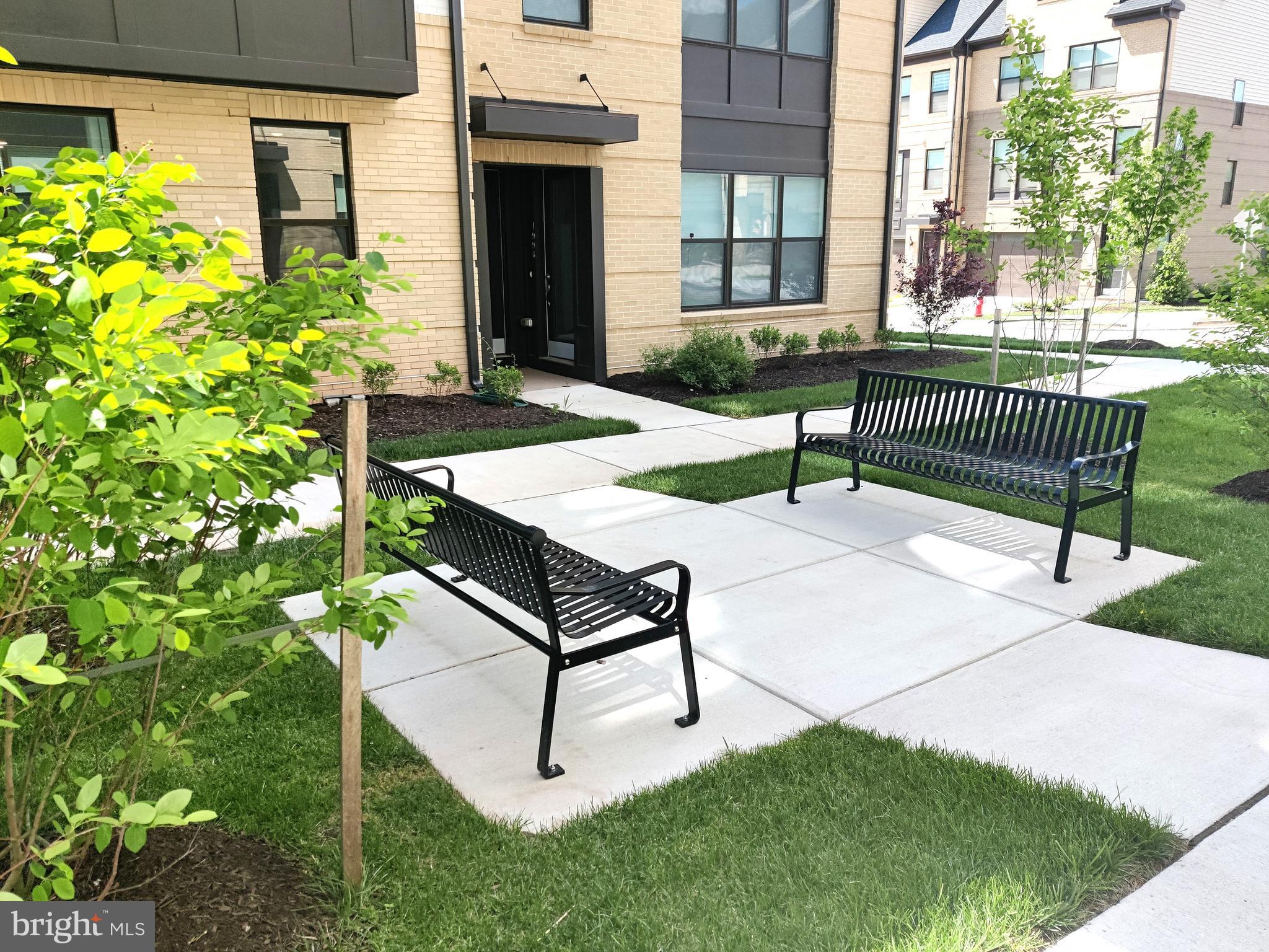 5002 Longmire Way, Unit 70 Chantilly, VA 20151 - Photo 26 of 28 a bench sitting in front of a building