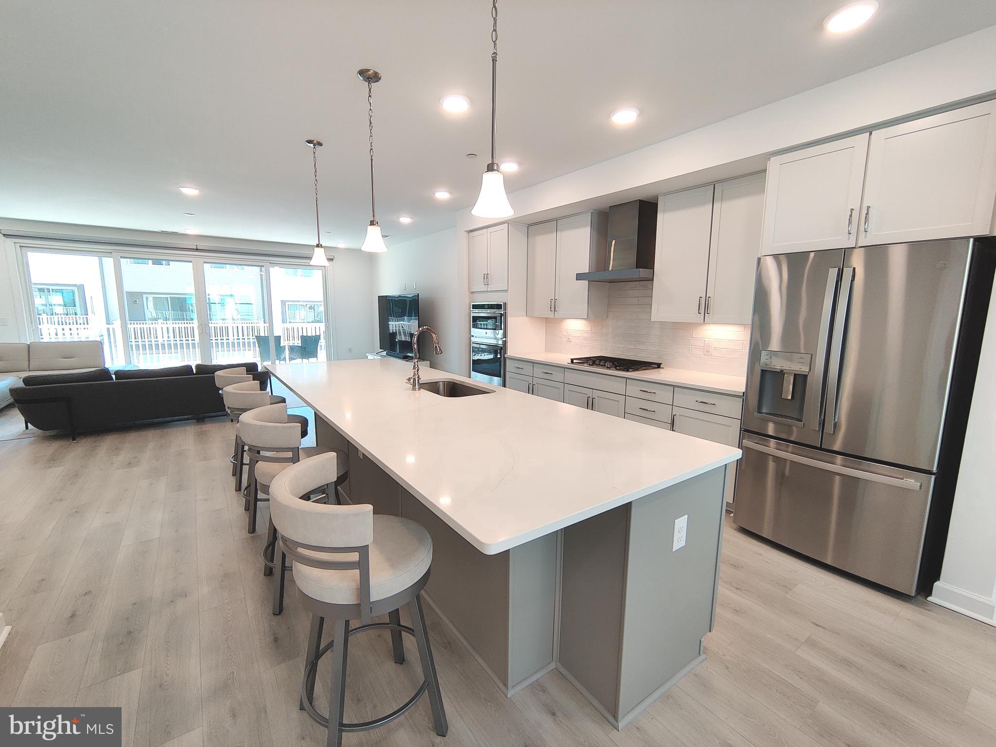 5002 Longmire Way, Unit 70 Chantilly, VA 20151 - Photo 8 of 28 a large kitchen with a table and chairs