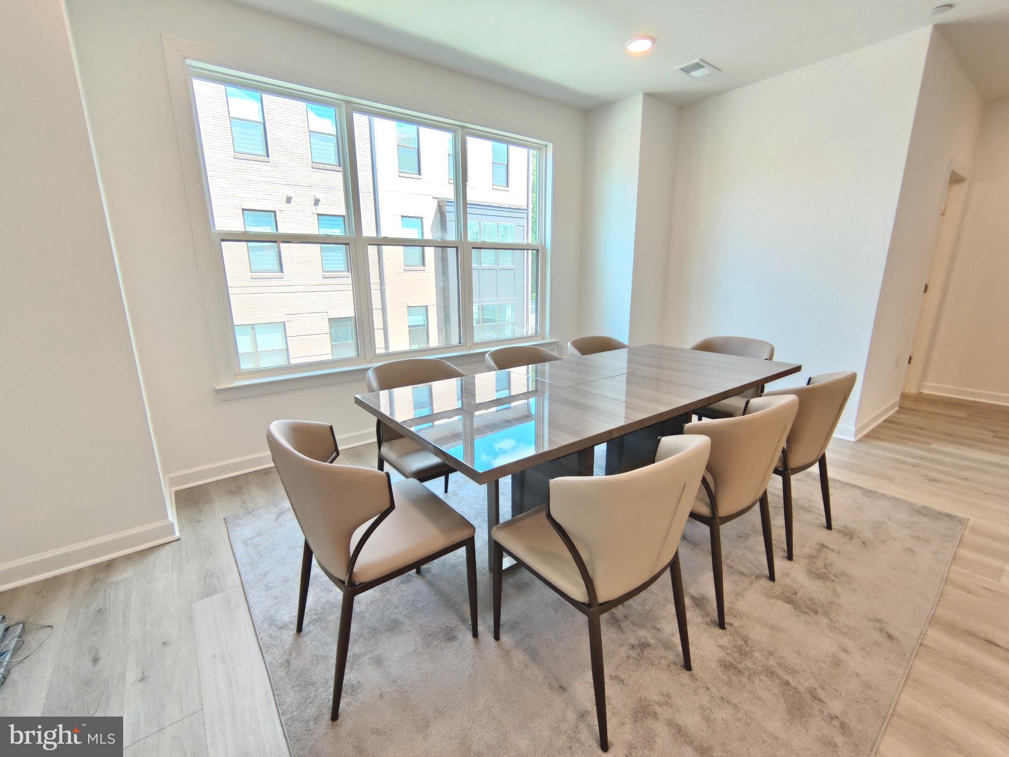 5002 Longmire Way, Unit 70 Chantilly, VA 20151 - Photo 9 of 28 a view of a dining room with furniture and a window