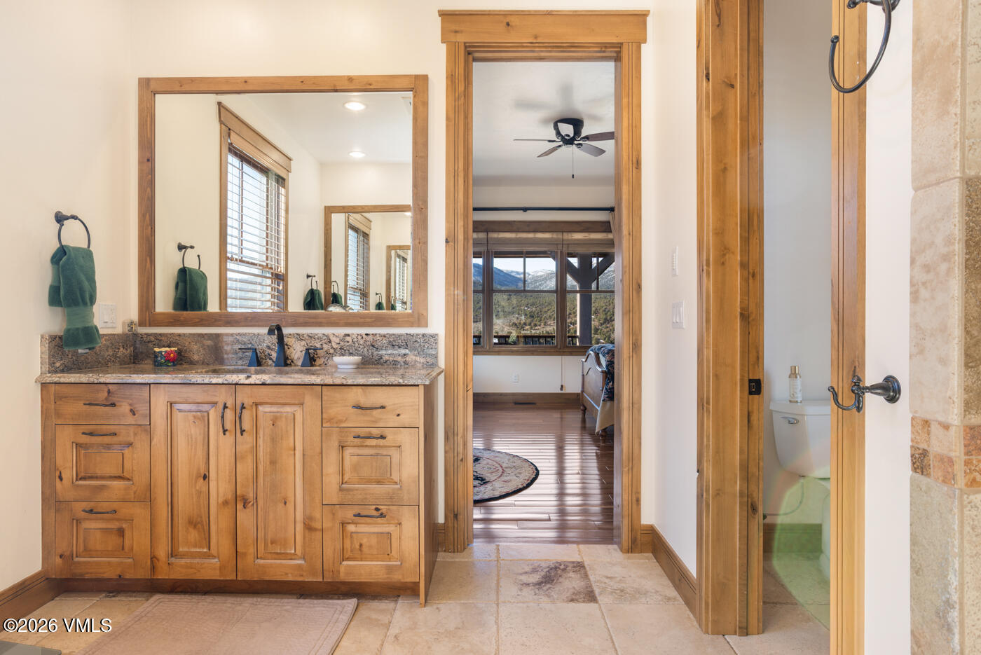 34900 Colorado River Road McCoy, CO 80463 - Photo 22 of 46 a bathroom with a granite countertop sink and a mirror