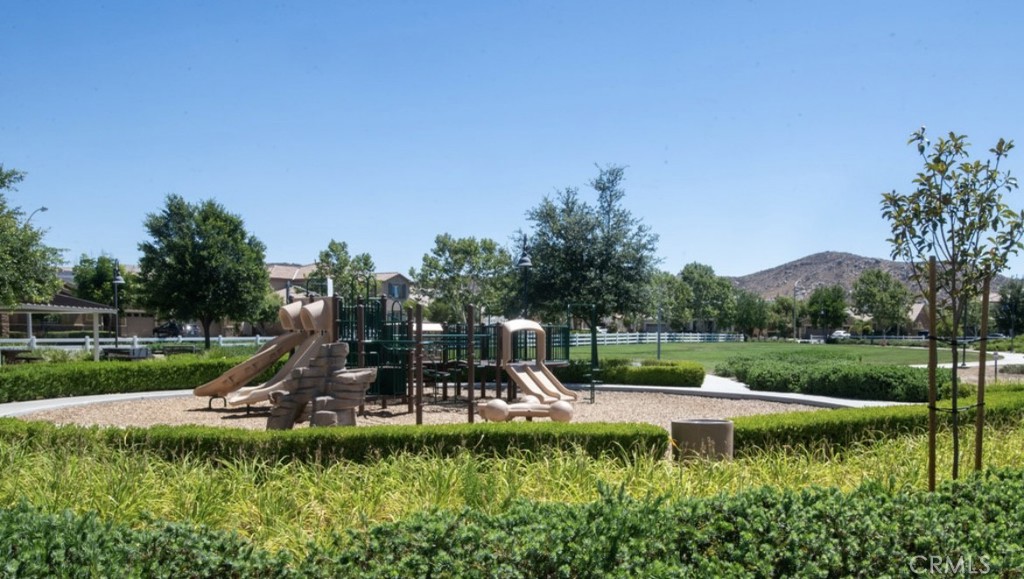 30237 Bristol Gate Lane Menifee, CA 92584 - Photo 23 of 34 a view of a park with slide