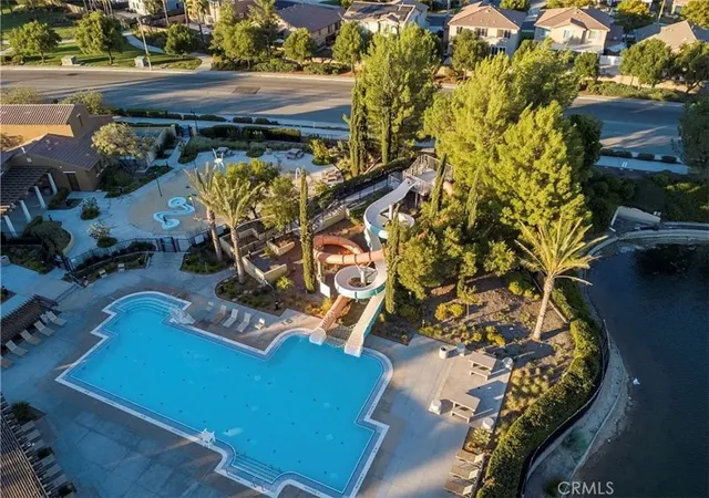 an aerial view of a house with a swimming pool