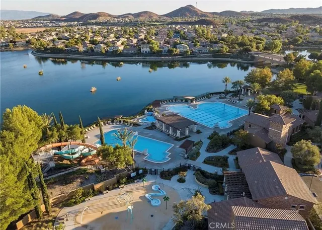 an aerial view of a house with a lake view