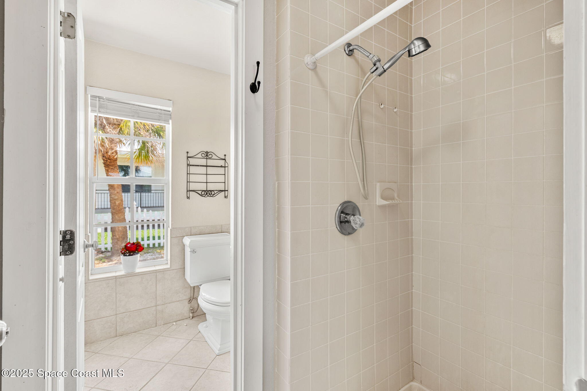 36 Vip Island, Unit A Grant, FL 32949 - Photo 15 of 63 a bathroom with a shower toilet and a shower