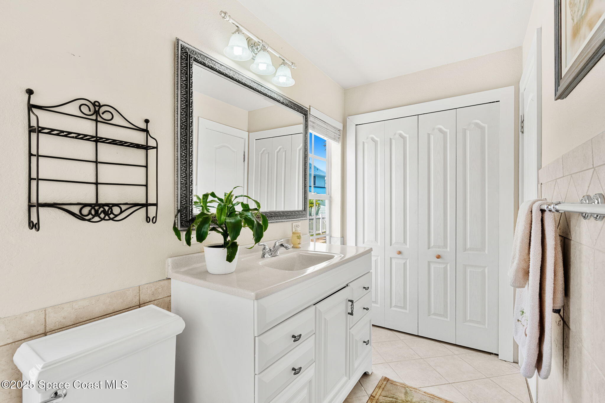 36 Vip Island, Unit A Grant, FL 32949 - Photo 16 of 63 a bathroom with a sink a mirror and a shower