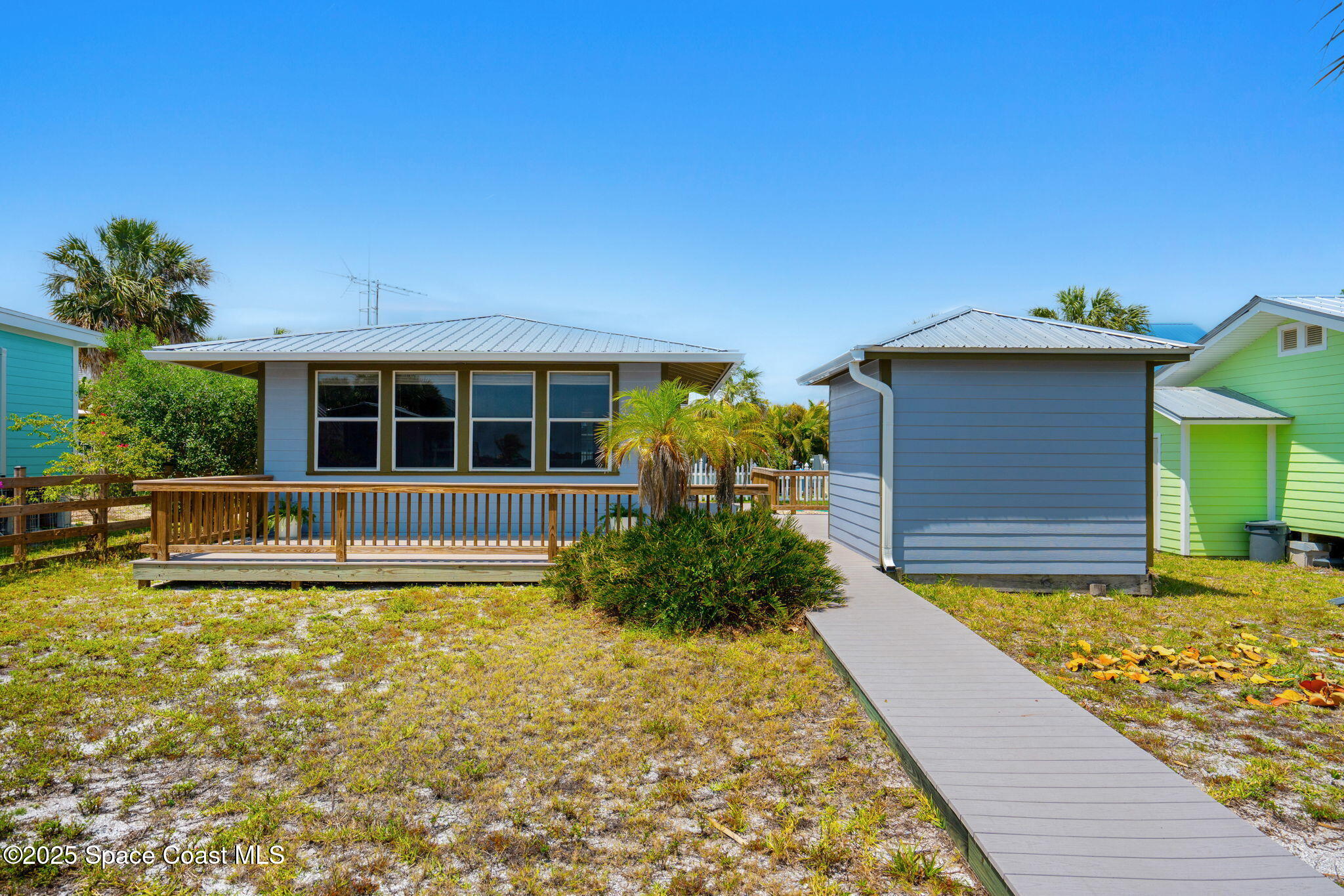 36 Vip Island, Unit A Grant, FL 32949 - Photo 22 of 63 a view of a house with a yard