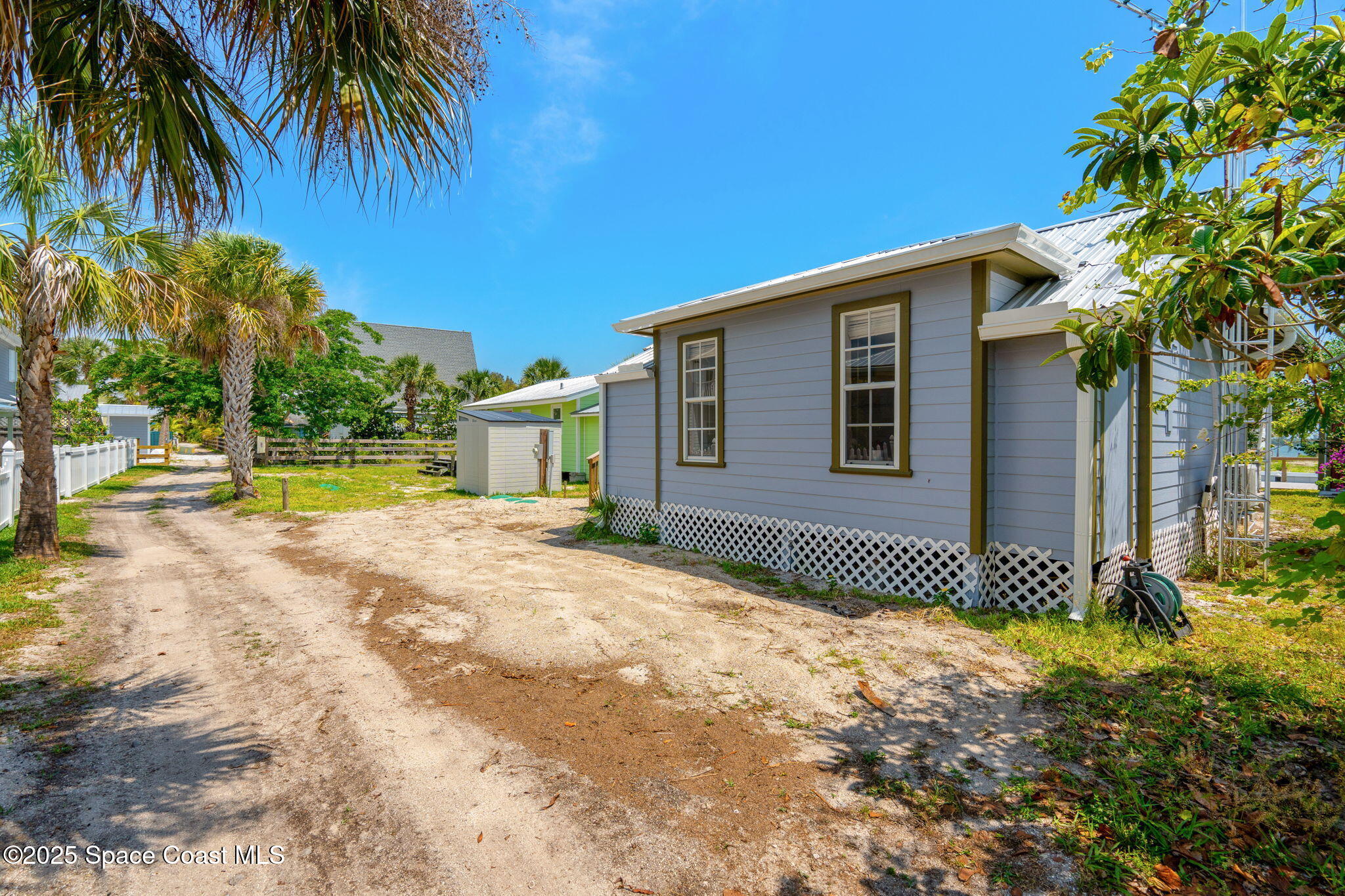 36 Vip Island, Unit A Grant, FL 32949 - Photo 25 of 63 a front view of a house with a garden