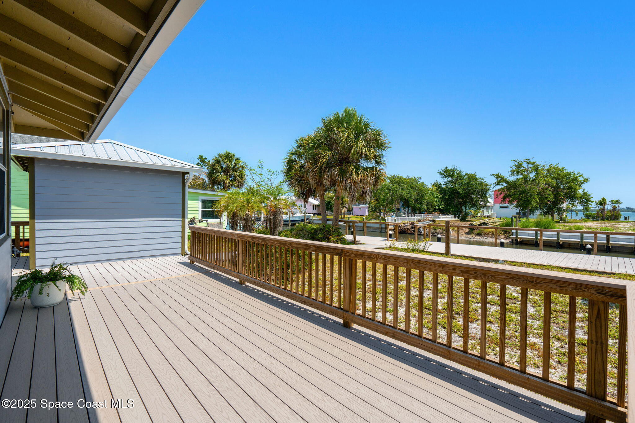 36 Vip Island, Unit A Grant, FL 32949 - Photo 31 of 63 a view of balcony with wooden floor and fence
