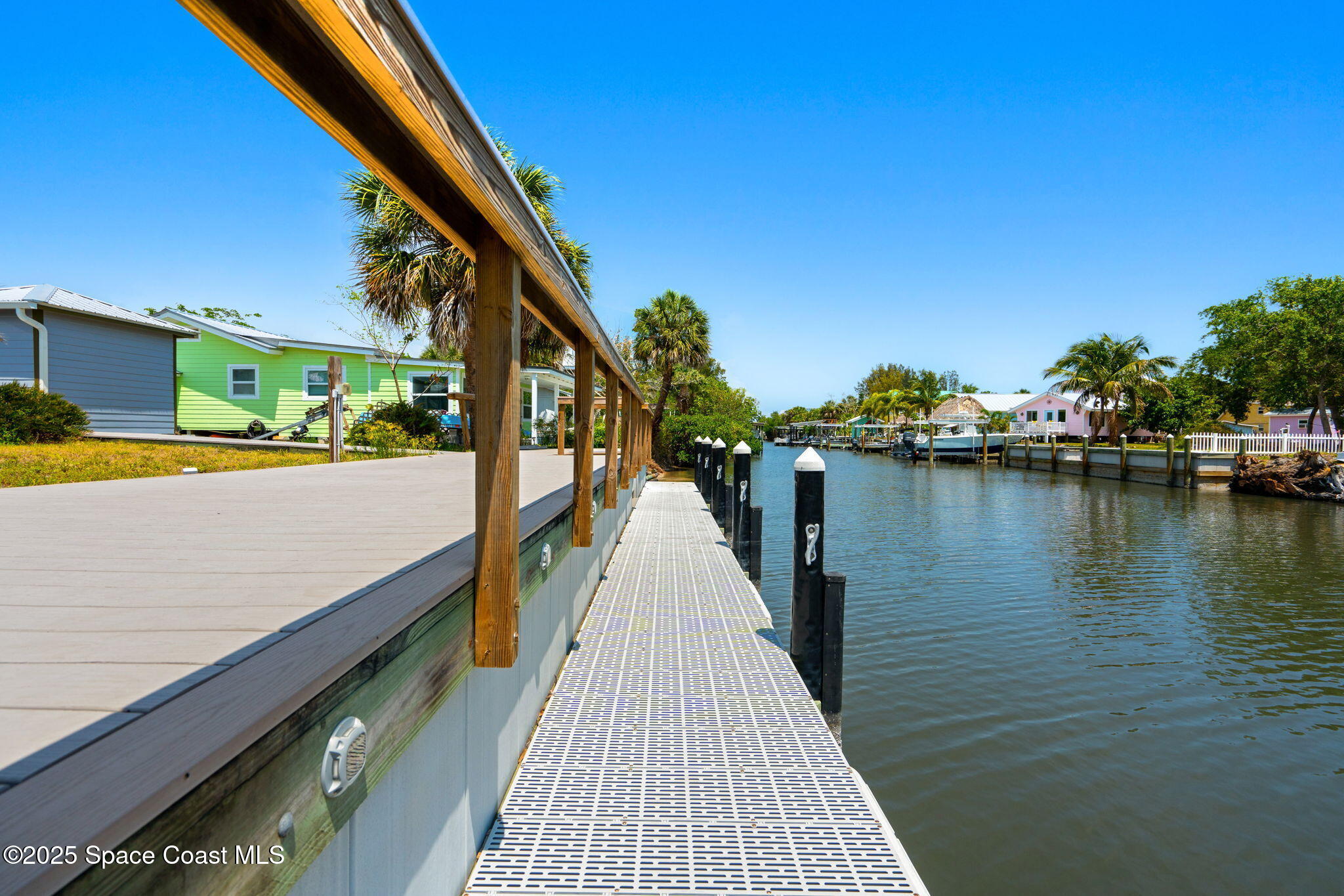 36 Vip Island, Unit A Grant, FL 32949 - Photo 41 of 63 a view of a balcony with wooden floor and lake view