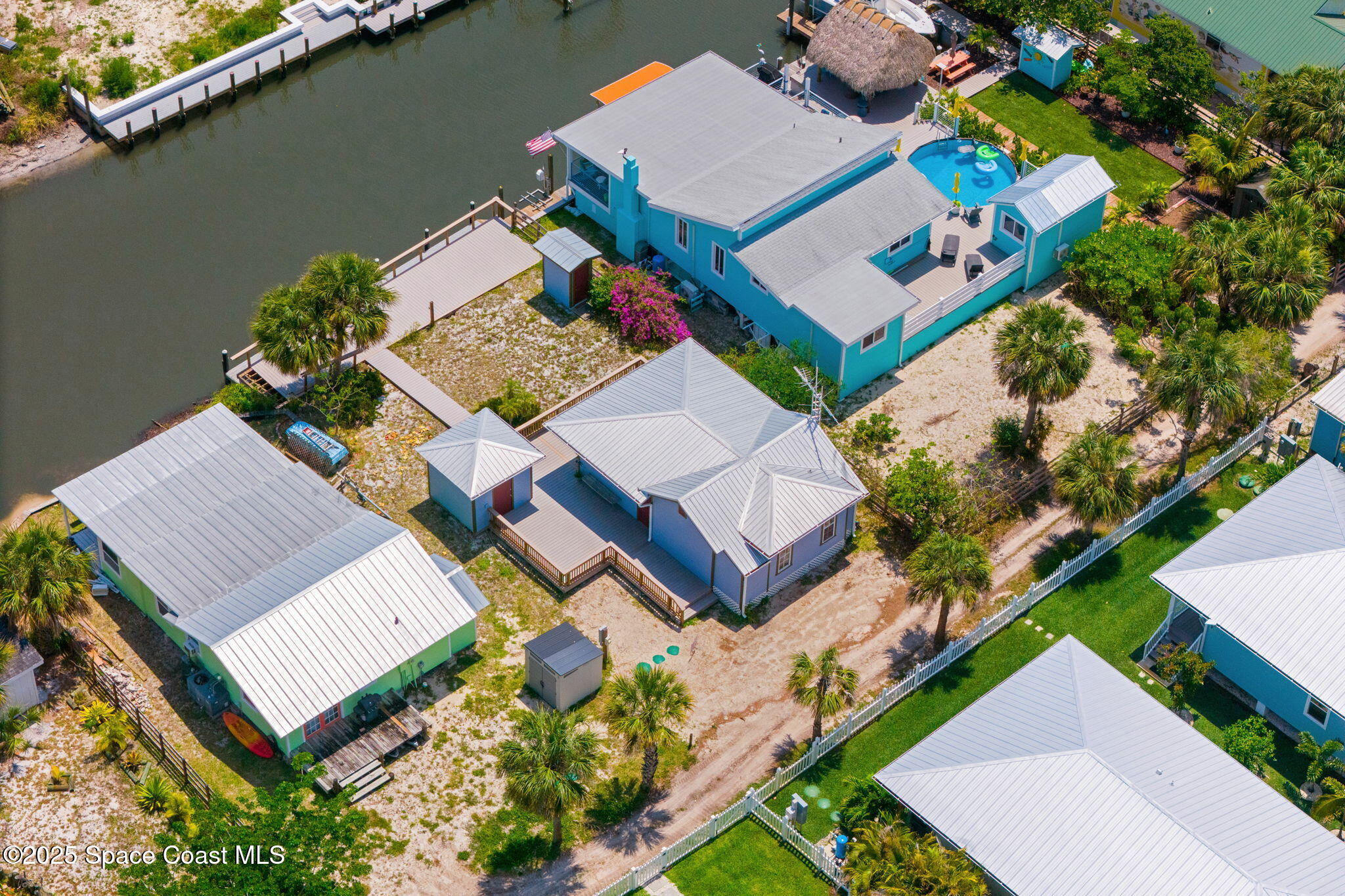 36 Vip Island, Unit A Grant, FL 32949 - Photo 51 of 63 an aerial view of a house with a garden and lake view