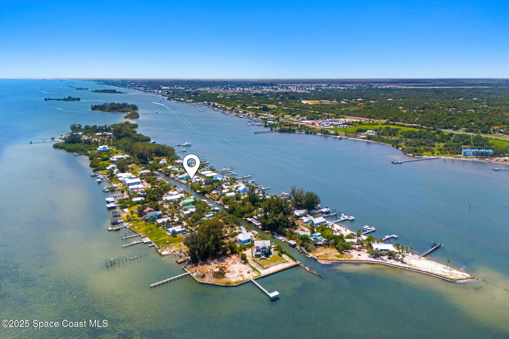 36 Vip Island, Unit A Grant, FL 32949 - Photo 59 of 63 a view of a lake with a nearby beach
