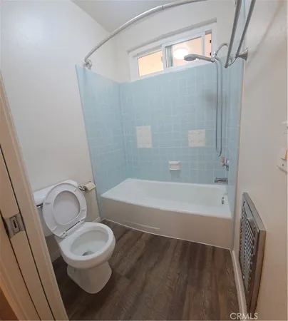 a bathroom with a toilet a sink and bathtub