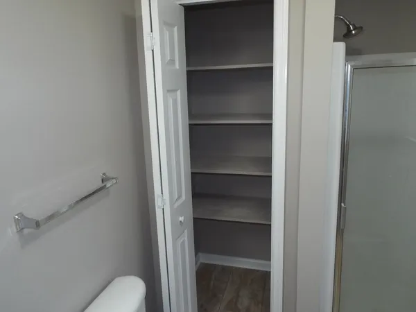 a bathroom with a sink and mirror with toilet