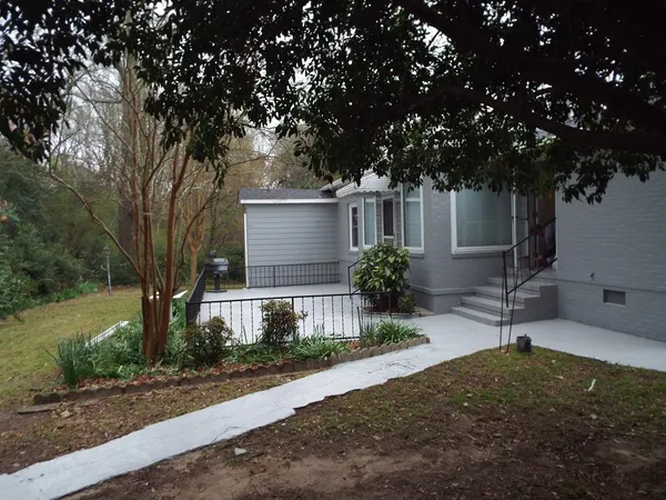 a view of a house with a yard