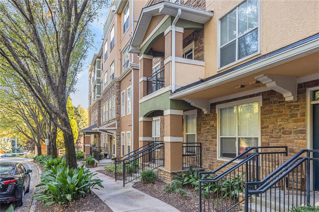 10 Perimeter Summit Boulevard, Unit 4131 Atlanta, GA 30319 - Photo 2 of 30 a view of a building next to a large tree