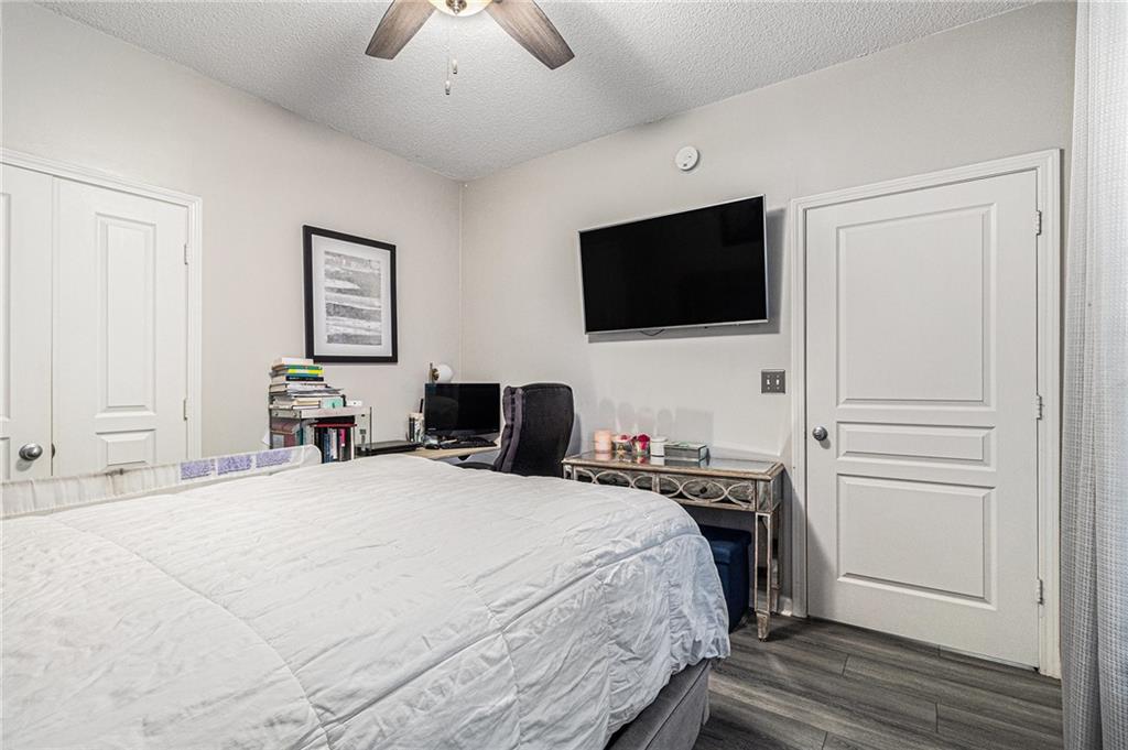 10 Perimeter Summit Boulevard, Unit 4131 Atlanta, GA 30319 - Photo 26 of 30 a bedroom with a bed and a flat screen tv