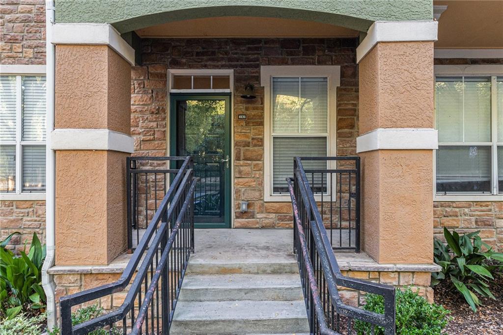 10 Perimeter Summit Boulevard, Unit 4131 Atlanta, GA 30319 - Photo 4 of 30 a front view of a house with glass windows and furniture