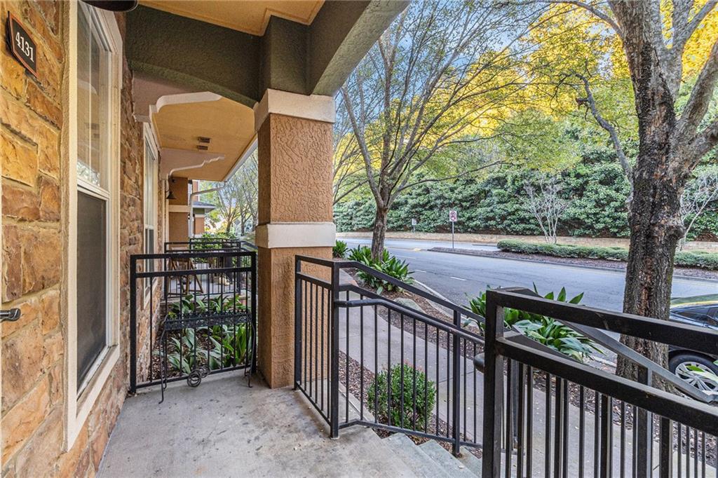 10 Perimeter Summit Boulevard, Unit 4131 Atlanta, GA 30319 - Photo 5 of 30 a view of a house with a small yard and wooden fence