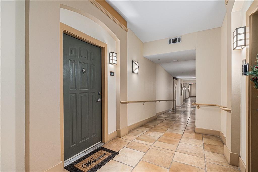 10 Perimeter Summit Boulevard, Unit 4131 Atlanta, GA 30319 - Photo 8 of 30 a view of a refrigerator in kitchen and an empty room