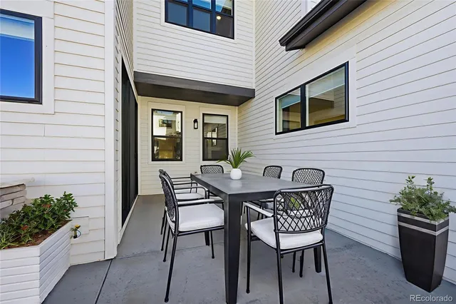 a view of a house with patio and wooden floor