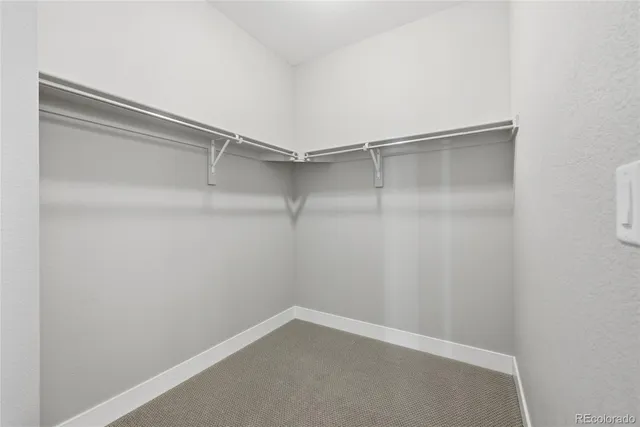 a view of an empty walk in closet