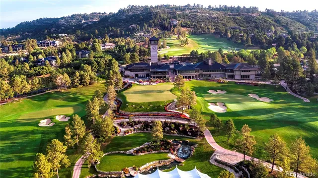 a view of a park with large trees