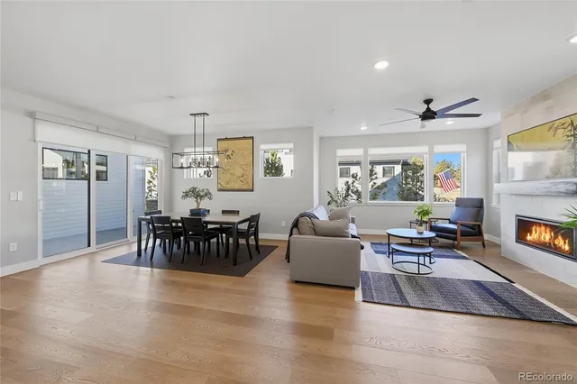 a living room with fireplace furniture and a flat screen tv