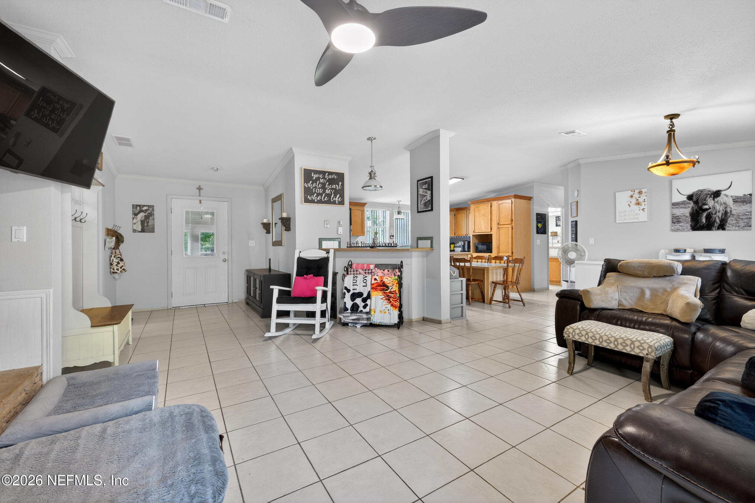 1755 Bennett Road St. Augustine, FL 32092 - Photo 13 of 34 a view of a livingroom with furniture and a flat screen tv