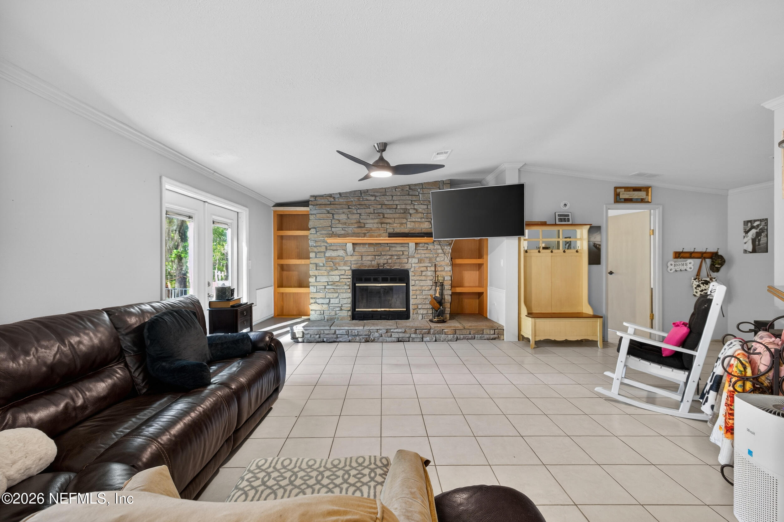 1755 Bennett Road St. Augustine, FL 32092 - Photo 14 of 34 a living room with furniture and a fireplace