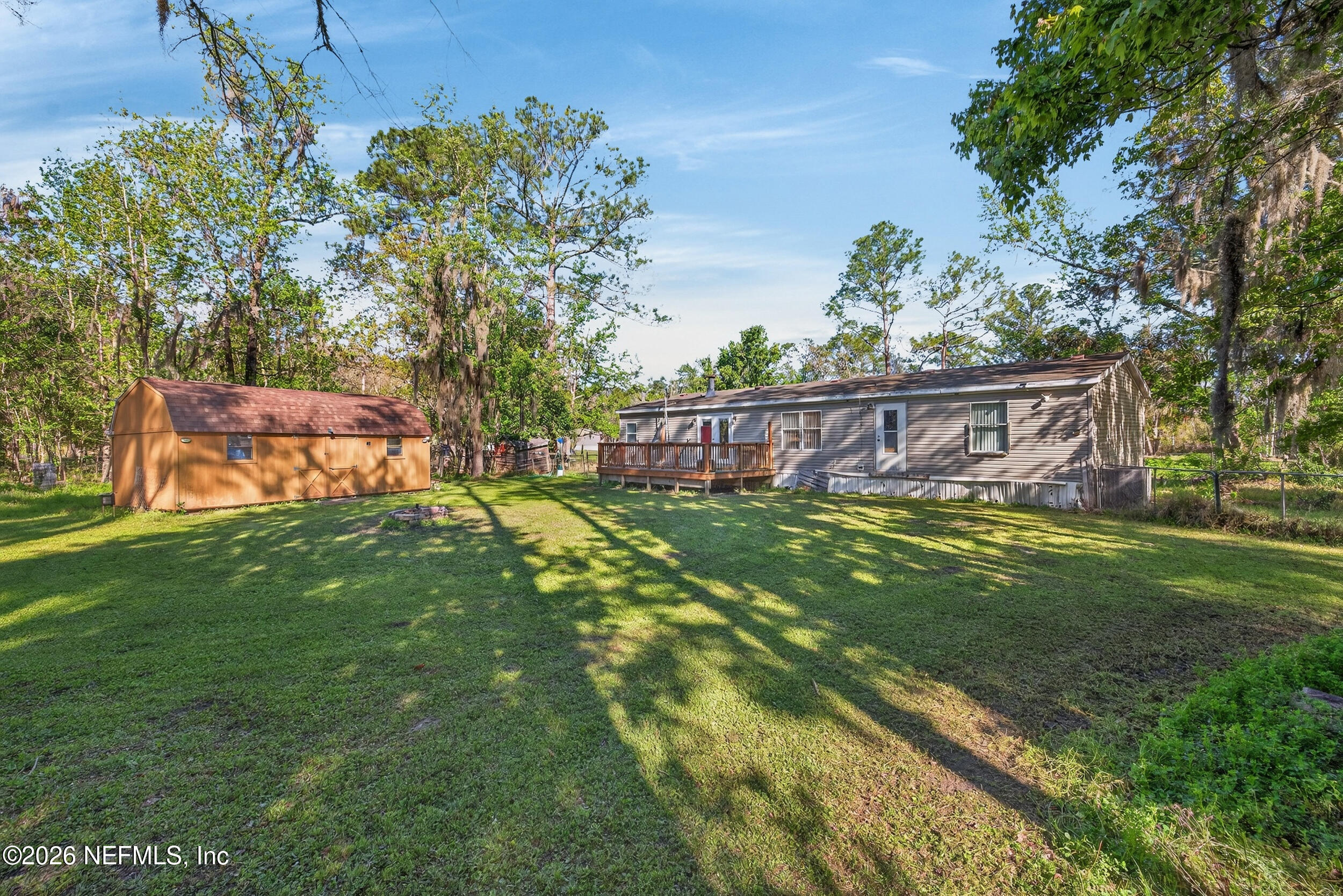 1755 Bennett Road St. Augustine, FL 32092 - Photo 25 of 34 a view of a yard with a tree