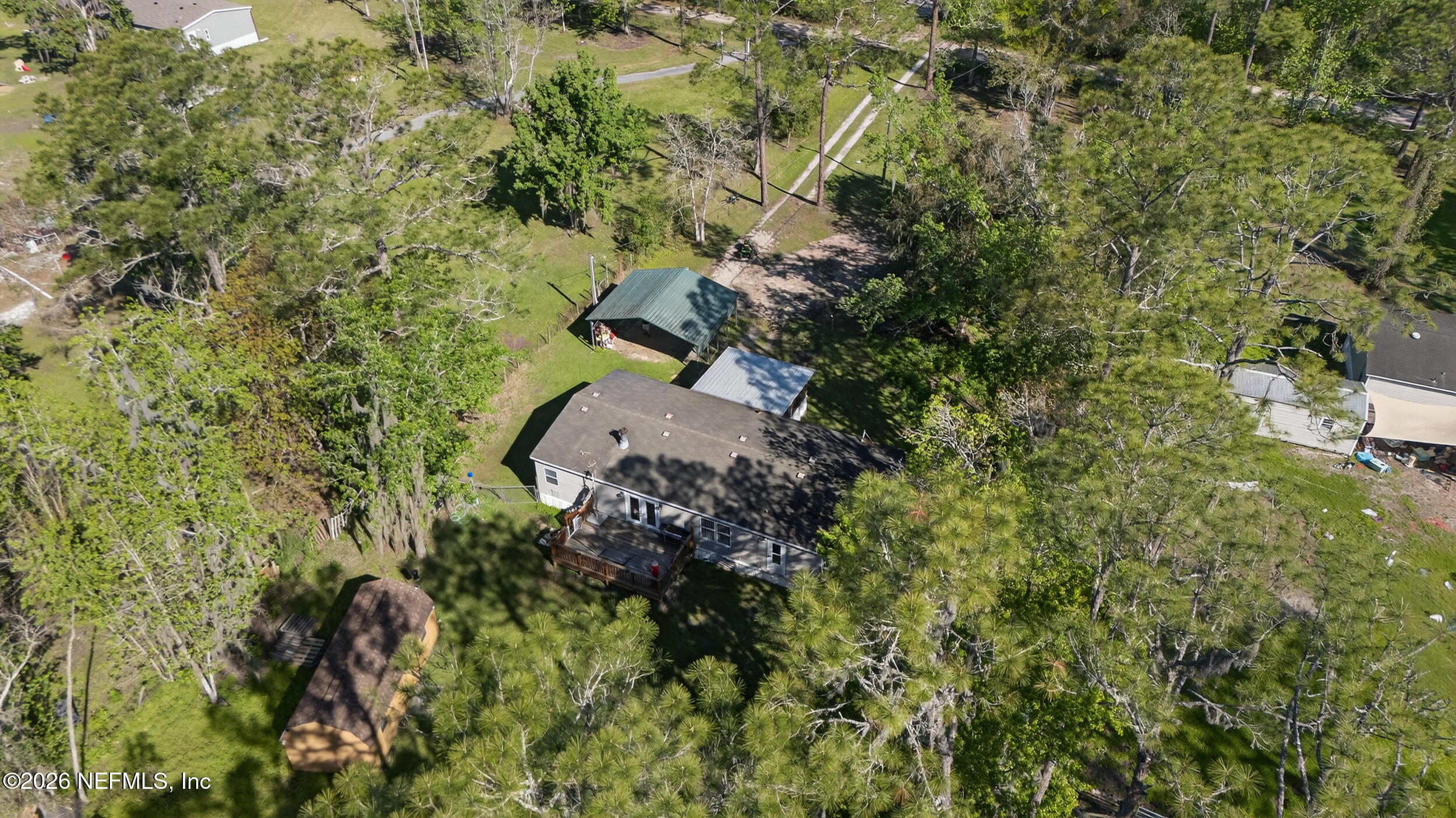 1755 Bennett Road St. Augustine, FL 32092 - Photo 33 of 34 an aerial view of residential house with outdoor space and trees all around