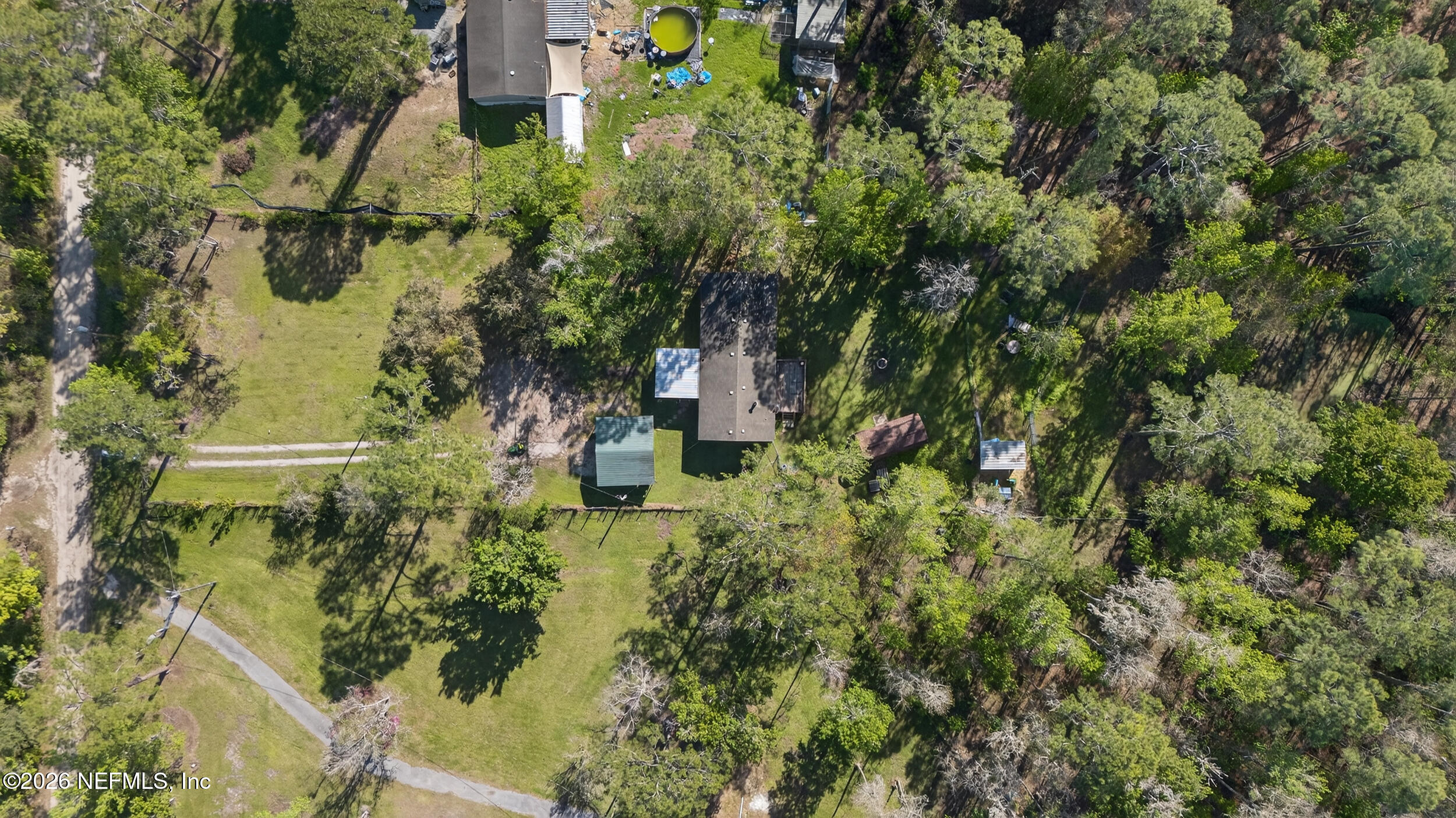 1755 Bennett Road St. Augustine, FL 32092 - Photo 34 of 34 an aerial view of residential house with outdoor space and trees all around