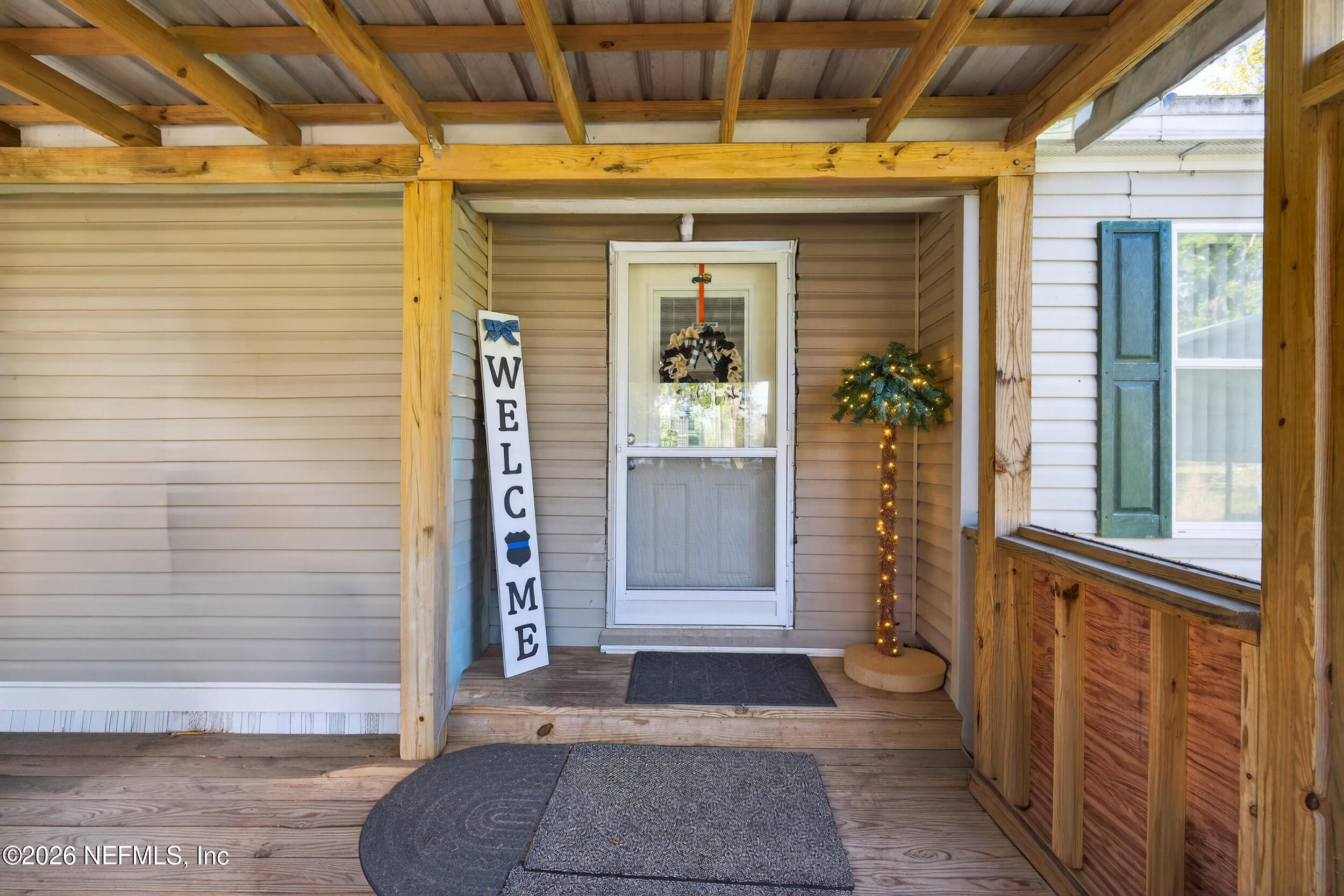 1755 Bennett Road St. Augustine, FL 32092 - Photo 5 of 34 a front view of a house with a garage