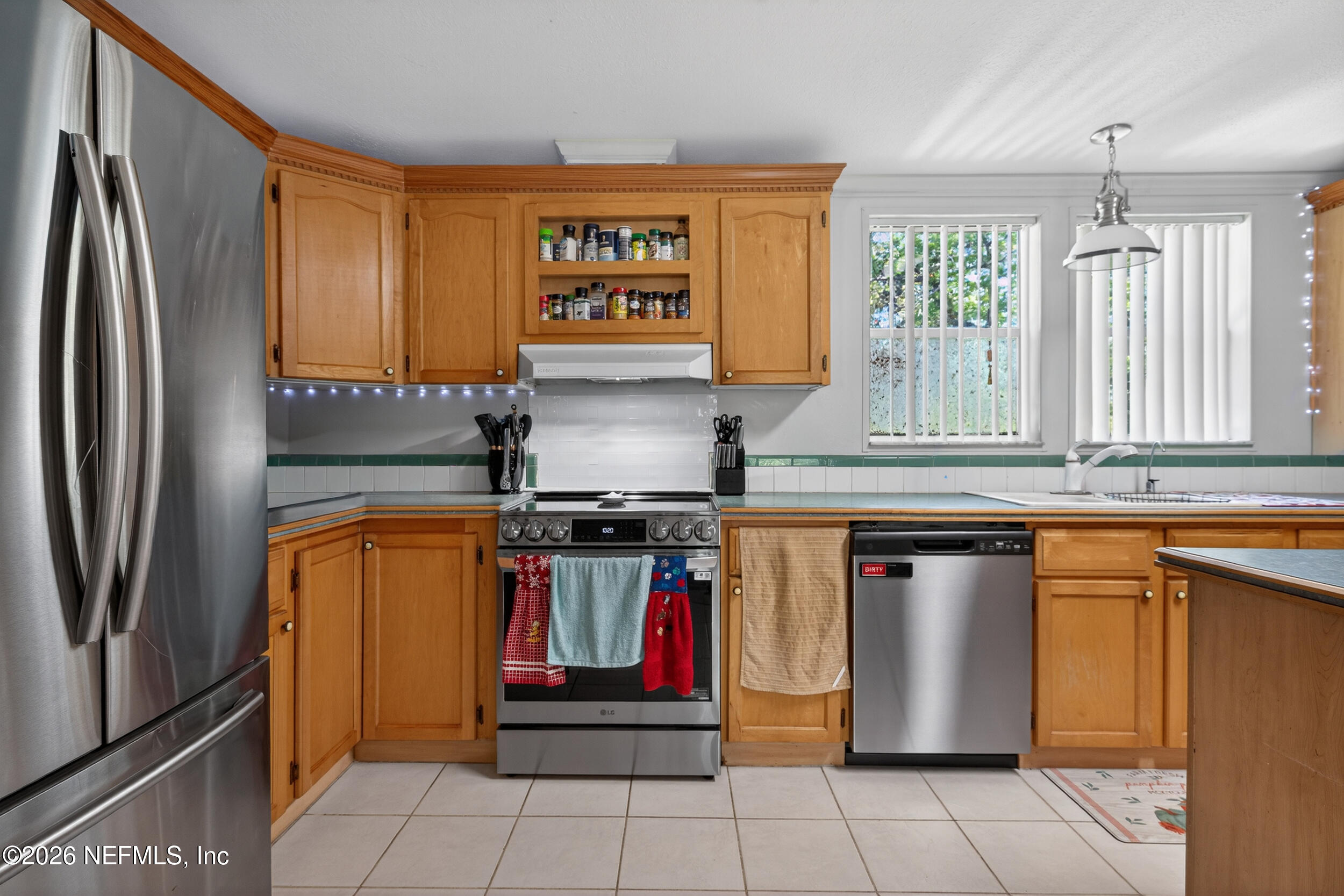 1755 Bennett Road St. Augustine, FL 32092 - Photo 9 of 34 a kitchen with stainless steel appliances granite countertop a refrigerator and a sink