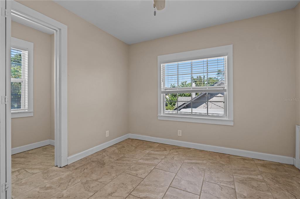222 25th Street North St. Petersburg, FL 33713 - Photo 17 of 32 an empty room with windows
